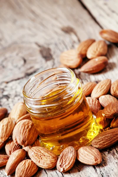 Sweet Almond Oil, first extraction, in a small glass jar — Stok fotoğraf