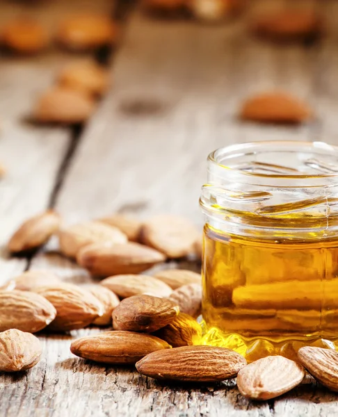 Sweet Almond Oil, first extraction, in a small glass jar — Stock Photo, Image