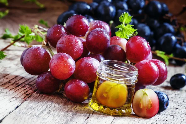 Healing grape seed oil in a glass jar