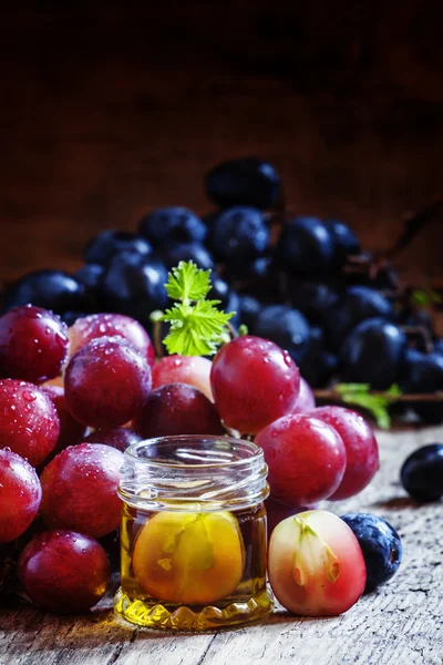 Healing grape seed oil in a glass jar