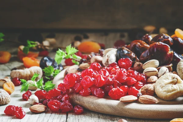 Dried pink cherry, a mix of dried fruits and nuts — Stock Photo, Image