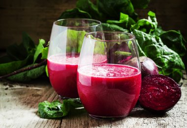 Beetroot smoothie in a large glasses clipart