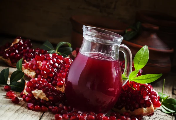 Pitcher with fresh pomegranate juice — Stock Photo, Image