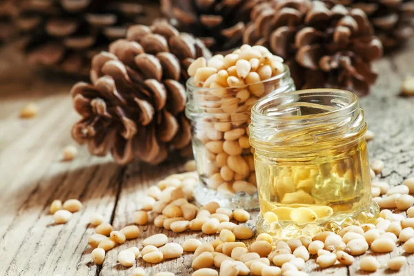 Cedar oil and cedar nuts — Stock Photo, Image