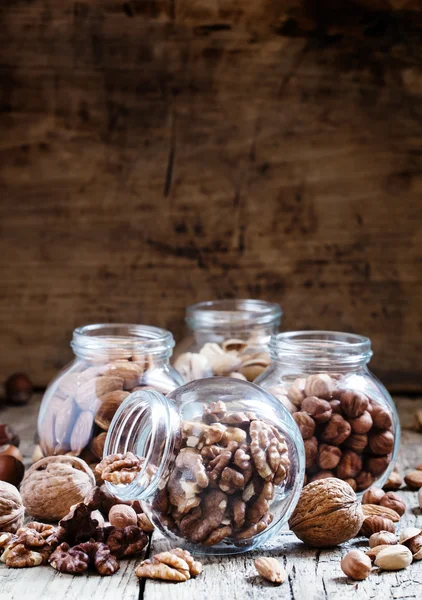 Walnuts in a glass jar, nut mix — Stock Photo, Image