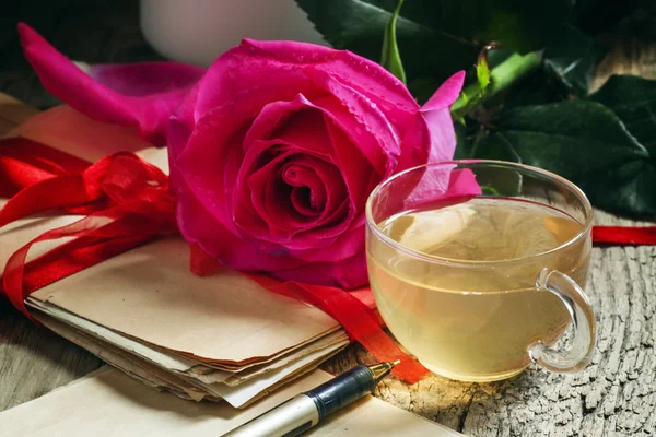 Vintage postcard with cup of herbal green tea and rose — Stock Photo, Image