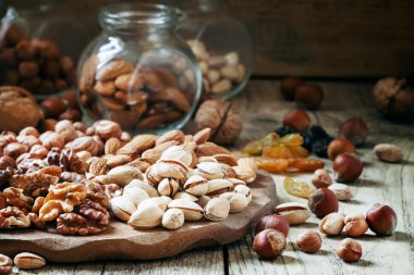 Nuts mix of pistachios, hazelnuts, walnuts and almonds  clipart