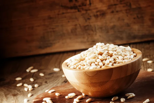 Puffed rice in a wooden bowl — Stock Photo, Image
