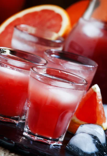 Cool juice from blood orange with ice cubes — Stock Photo, Image