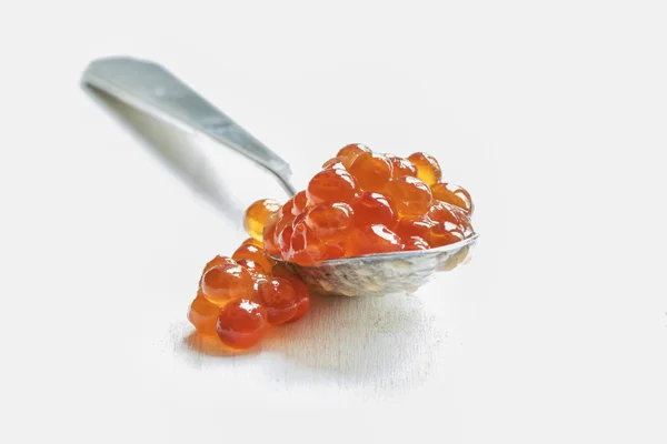 Red caviar in the silver spoon — Stock Photo, Image