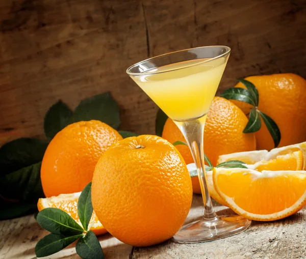 Yellow cocktail with orange juice in a martini glass — ストック写真