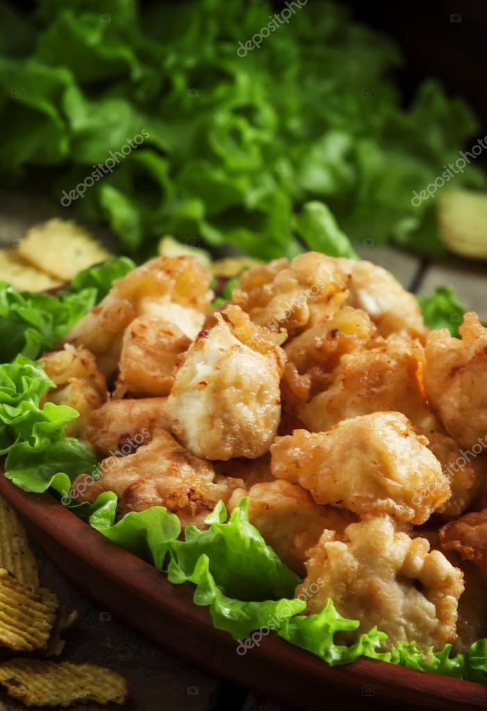 Nuggets, chicken tempura with green salad and tomato sauce Stock Photo