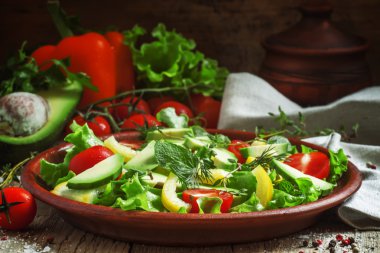 Salad on a clay plate