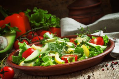Salad on a clay plate