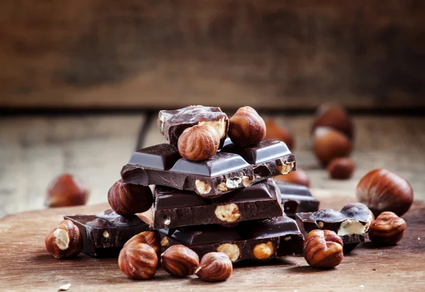 Dark chocolate with hazelnuts — Stock Photo, Image