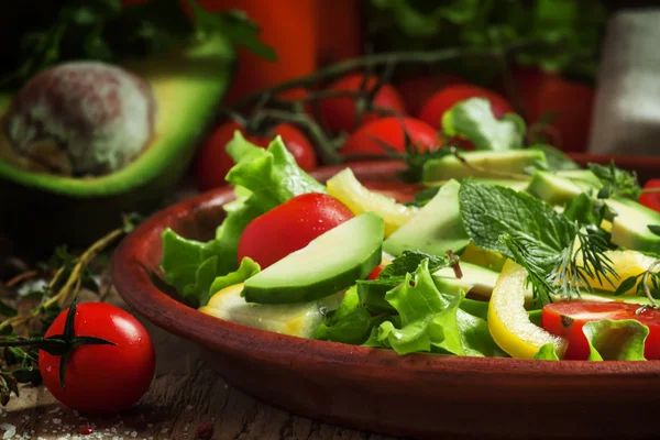 Salad on a clay plate
