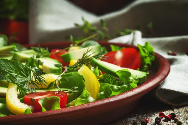 Salad on a clay plate