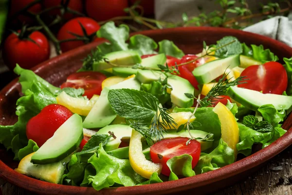 Salad on a clay plate