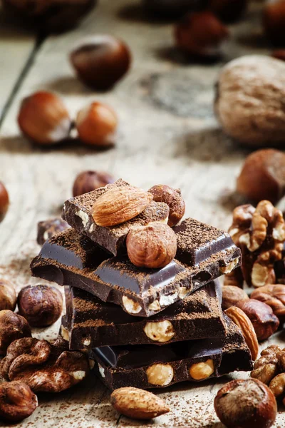 Dark chocolate with hazelnuts — Stock Photo, Image