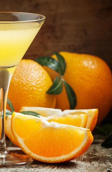 Yellow cocktail with orange juice in a martini glass — ストック写真