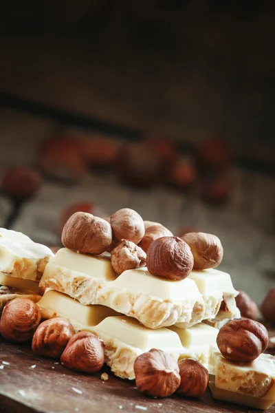 White chocolate with hazelnuts — Stock Photo, Image