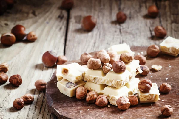 White chocolate with hazelnuts — Stock Photo, Image