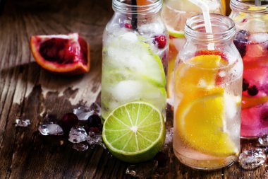 Refreshing lemonades with citrus fruits and ice