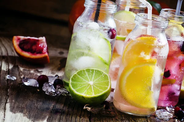 Refreshing lemonades with citrus fruits and ice