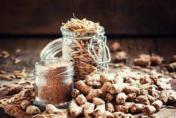 Oat bran, grain oats, oat flour, in glass jars — Stock Photo, Image