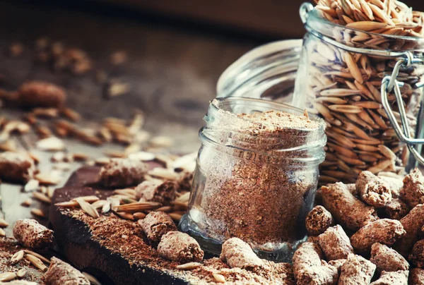 Oat bran, grain oats, oat flour, in glass jars — Stock Photo, Image