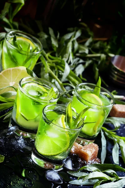 Alcoholic cocktail with lime green, lemon juice, cane sugar, soda