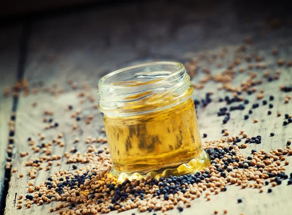 Oil of mustard in a small jar — Stok fotoğraf