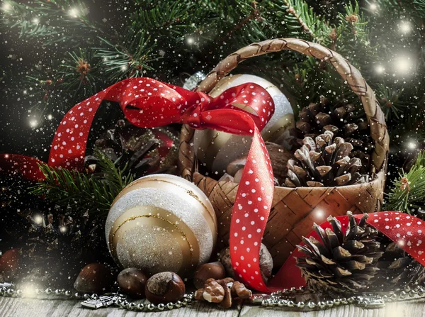 Wicker basket with Christmas balls and pine cones — Stok fotoğraf