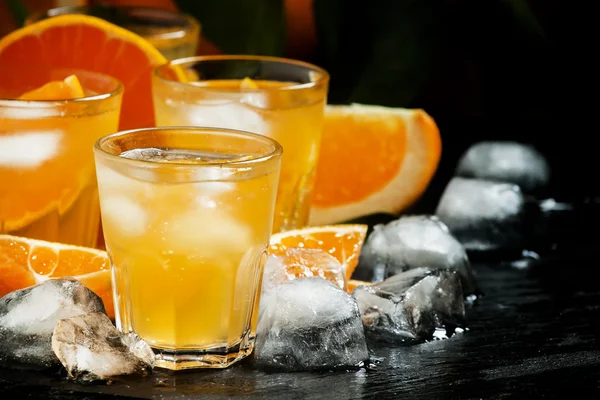 Alcoholic cocktail of orange juice, ice and soda — Stock Photo, Image