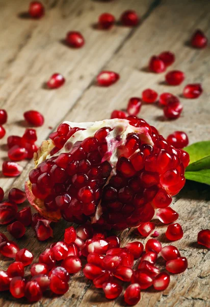 Fresh peeled pomegranate with ruby red beans — Stock Photo, Image