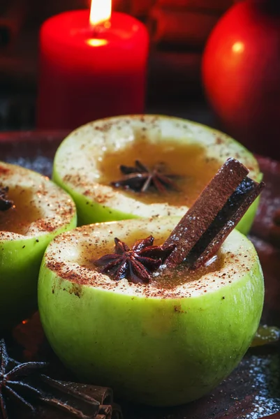 Apple cider apples in halves with cinnamon and anise