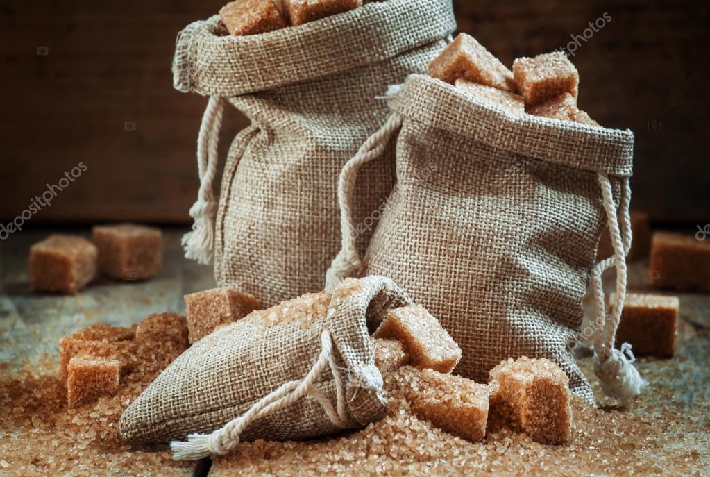 Cane brown sugar cubes and crystals in burlap sacks Stock Photo by ©5PH  109575154