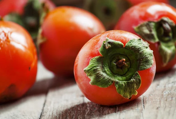 Dojrzały pomarańczowy persimmons — Zdjęcie stockowe