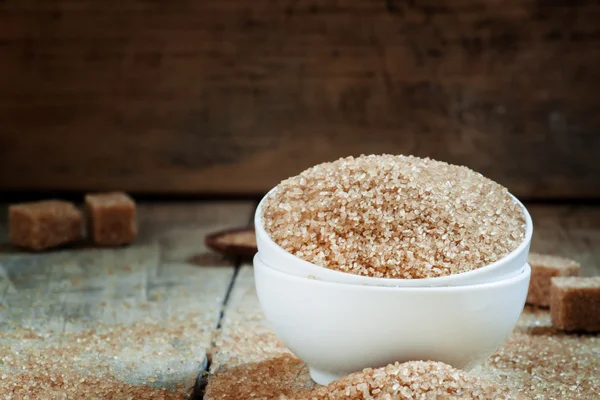 Brown sugar in a white porcelain bowl — Stock Photo, Image