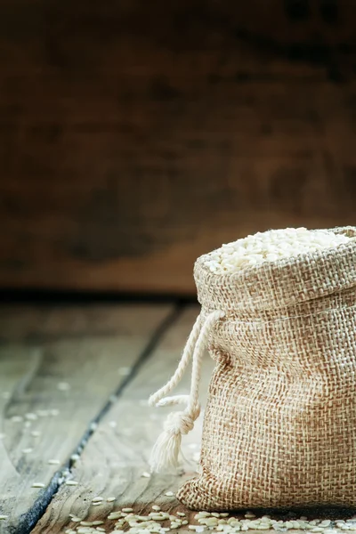 White sesame seeds in burlap sack — Stock Photo, Image
