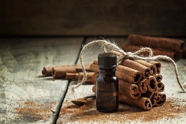 Essential cinnamon oil in a small bottle