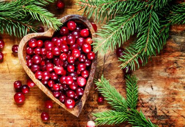 Fresh cranberries in heart shaped bowl 
