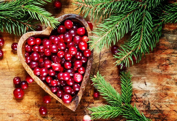 Fresh cranberries in heart shaped bowl — Stock Photo, Image