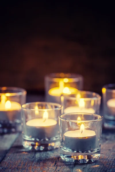Burning small candles in glass candlesticks — ストック写真