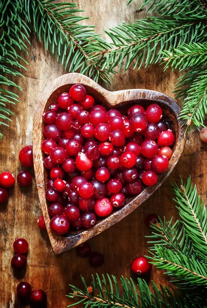 Fresh cranberries in heart shaped bowl — ストック写真