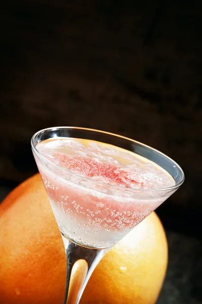 Pink cocktail with grapefruit and soda in a martini glass — Stok fotoğraf