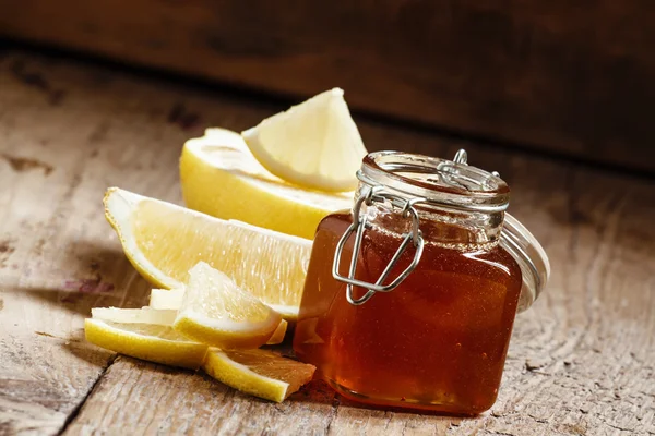 Honey with lemon, herbal medicine and healthy food concept — Stock Fotó