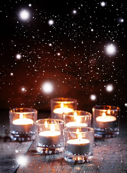 Burning small candles in glass candlesticks — Stock Photo, Image