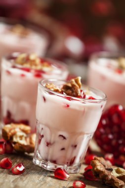 Homemade yogurt with walnuts and pomegranate seeds 