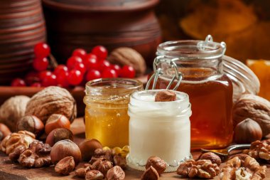 Three types of honey with walnuts and hazelnuts 